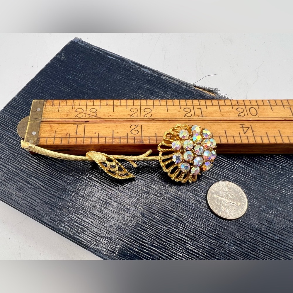 Vintage gold tone flower brooch pin with AB rhinestone center
